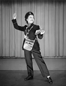 Woman performing as a bus conductor in a comic sketch Woman performing as a bus conductor in a comic sketch