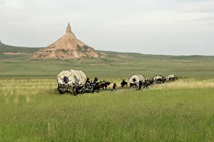 Oregon Trail pioneers passing Chimney Rock Oregon Trail pioneers passing Chimney Rock