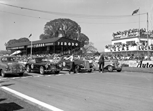 Cars lined up at the start of a race at Goodwood motor circuit Cars lined up at the start of a race at Goodwood motor circuit