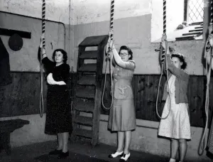 Prints of Three ladies holding their bell ropes, ready to start ringing George Garland Collection West Sussex Record Office Ref. No. Garland N26809 West Sussex Prints: Print of Lady Bellringers at Petworth Parish Church