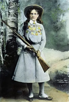 ANNIE OAKLEY (1860-1926). Oil over a photograph, 1899 ANNIE OAKLEY (1860-1926). Oil over a photograph, 1899