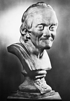 Assumed name of Francois Marie Arouet. French man of letters. Marble bust, 1781, by Jean Antoine Houdon Assumed name of Francois Marie Arouet. French man of letters. Marble bust, 1781, by Jean Antoine Houdon