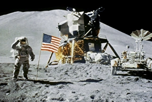 Astronaut Jim Irwin saluting the American flag by the lunar rover and the lunar module Falcon at the Hadley-Apennine Astronaut Jim Irwin saluting the American flag by the lunar rover and the lunar module Falcon at the Hadley-Apennine