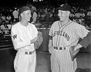 BASEBALL, 1937. Bucky Jacobs of the Washington Senators and Bob Feller of the Cleveland BASEBALL, 1937. Bucky Jacobs of the Washington Senators and Bob Feller of the Cleveland