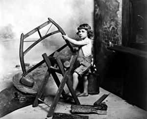 BOY SAWING, 1902. Photographed by Fritz W. Guerin, St. Louis, 1902 BOY SAWING, 1902. Photographed by Fritz W. Guerin, St. Louis, 1902