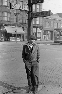 CHICAGO, 1941. Man standing at the corner of State and 44th Streets in Chicago, Illinois CHICAGO, 1941. Man standing at the corner of State and 44th Streets in Chicago, Illinois