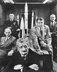 Black and white print of Hermann Oberth with officials