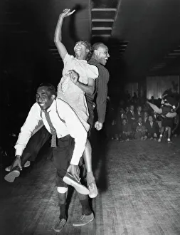Three dancers dancing the Harlem conga, a blend of the lindy hop Three dancers dancing the Harlem conga, a blend of the lindy hop
