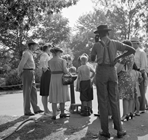 DETROIT, 1942. People waiting to drink from a water fountain at the zoo in Detroit DETROIT, 1942. People waiting to drink from a water fountain at the zoo in Detroit