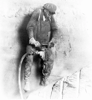 EMPIRE STATE BUILDING 1931. Man with a pneumatic drill, Empire State Building, New York City EMPIRE STATE BUILDING 1931. Man with a pneumatic drill, Empire State Building, New York City