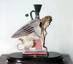 ETRUSCAN VASE. Painted Etruscan vase in the shape of a female sphinx, 8th - 5th century B ETRUSCAN VASE. Painted Etruscan vase in the shape of a female sphinx, 8th - 5th century B