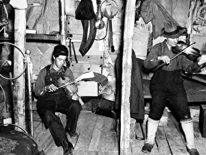 FIDDLERS, 1937. Playing the fiddle to the tune of The Arkansas Traveler FIDDLERS, 1937. Playing the fiddle to the tune of The Arkansas Traveler