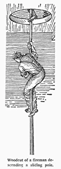 FIREMAN DESCENDING POLE. Firefighters, respoding to an alarm, slide down the pole FIREMAN DESCENDING POLE. Firefighters, respoding to an alarm, slide down the pole