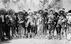 FRANCISCO PANCHO VILLA (1877-1923). Mexican revolutionary leader. Photographed wearing bandoliers with his military FRANCISCO PANCHO VILLA (1877-1923). Mexican revolutionary leader. Photographed wearing bandoliers with his military