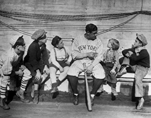 GEORGE H. RUTH (1895-1948). Known as Babe Ruth. American baseball player. Ruth talking to a group of children GEORGE H. RUTH (1895-1948). Known as Babe Ruth. American baseball player. Ruth talking to a group of children