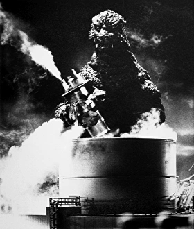 GODZILLA. Godzilla destroying an oil refinery in one of the Japanese Godzilla movies GODZILLA. Godzilla destroying an oil refinery in one of the Japanese Godzilla movies