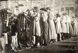 A group of young knitters working at the textile machines at the Loudon Hosiery Mill in A group of young knitters working at the textile machines at the Loudon Hosiery Mill in