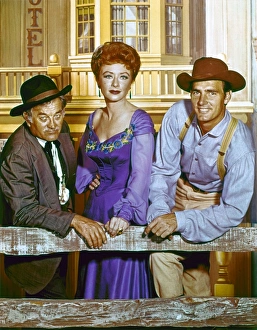 GUNSMOKE, c1960. Cast members Milburn Stone, Amanda Blake, and Dennis Weaver in a publicity photograph for GUNSMOKE, c1960. Cast members Milburn Stone, Amanda Blake, and Dennis Weaver in a publicity photograph for