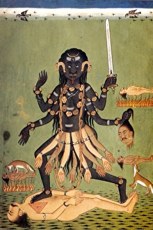 HINDU GODDESS: KALI. Holding a sword and a severed head, Kali dances on top of HINDU GODDESS: KALI. Holding a sword and a severed head, Kali dances on top of
