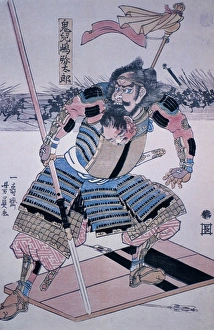 JAPAN: SAMURAI. Samurai warrior on his shield, holding the head of one of his victims JAPAN: SAMURAI. Samurai warrior on his shield, holding the head of one of his victims