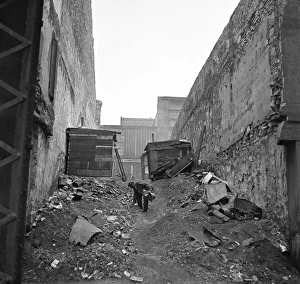 ST. LOUIS: HOBO, 1936. A hobo picking through a mound of trash, St. Louis, Missouri ST. LOUIS: HOBO, 1936. A hobo picking through a mound of trash, St. Louis, Missouri