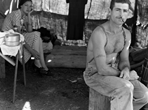 An unemployed lumberjack with his wife in a migrant workers camp for the bean harvest, Marion County, Oregon An unemployed lumberjack with his wife in a migrant workers camp for the bean harvest, Marion County, Oregon