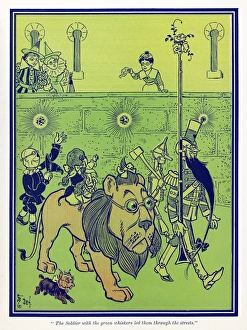 WIZARD OF OZ, 1900. The Soldier with the green whiskers led them through the streets WIZARD OF OZ, 1900. The Soldier with the green whiskers led them through the streets