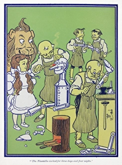 WIZARD OF OZ, 1900. The Tinsmiths worked for three days and four nights. Illustration by W WIZARD OF OZ, 1900. The Tinsmiths worked for three days and four nights. Illustration by W