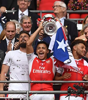 Alexis Sanchez (Arsenal) lifts the FA Cup Alexis Sanchez (Arsenal) lifts the FA Cup