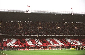 Arsenal fans in the North Bank hold up cards that read 2006 Arsenal fans in the North Bank hold up cards that read 2006