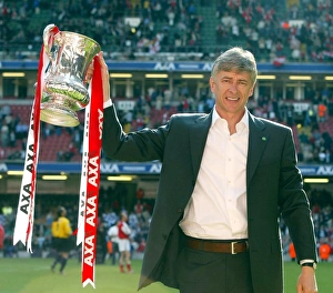 Arsenal manager Arsene Wenger lifts the FA Cup after the match Arsenal manager Arsene Wenger lifts the FA Cup after the match