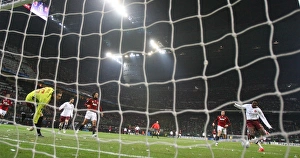Emmanuel Adebayor shoots past AC Milan goalkeeper Zelijo Kalac to score the 2nd Arsenal Emmanuel Adebayor shoots past AC Milan goalkeeper Zelijo Kalac to score the 2nd Arsenal
