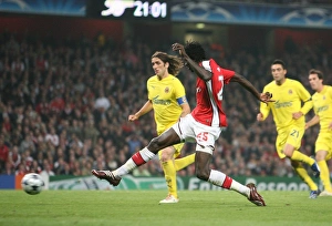 Emmanuel Adebayor shoots past Villarreal goalkeeper Emmanuel Adebayor shoots past Villarreal goalkeeper