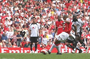 Gilberto shoots past Fulham goalkeeper Antti Niemi to score the 3rd Arsenal goal from the Gilberto shoots past Fulham goalkeeper Antti Niemi to score the 3rd Arsenal goal from the