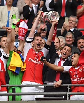 Per Mertesacker and Laurent Koscielny (Arsenal) lift the FA Cup. Arsenal 2:1 Chelsea Per Mertesacker and Laurent Koscielny (Arsenal) lift the FA Cup. Arsenal 2:1 Chelsea