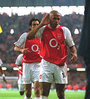 Robert Pires celebrates scoring the Arsenal goal with Thierry Henry Robert Pires celebrates scoring the Arsenal goal with Thierry Henry