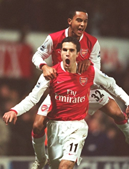 Robin van Persie celebrates scoring the 2nd Arsenal goal with Theo Walcott Robin van Persie celebrates scoring the 2nd Arsenal goal with Theo Walcott