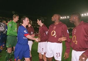 Images Dated 6th January 2006: Sol Campbell and Kolo Toure (Arsenal) shake hands with Gary Neville (Man Utd)