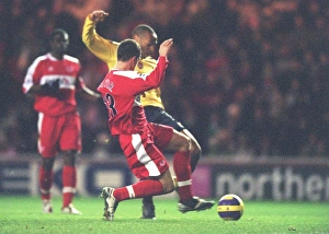 Thierry Henry shoots past Andrew Taylor and Middlesbrough goalkeeper Brad Jones to score Thierry Henry shoots past Andrew Taylor and Middlesbrough goalkeeper Brad Jones to score