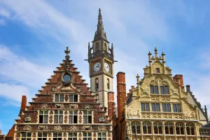Ghent clock tower and the Vrije Schippers Guildhall, Graslei quay, Ghent, Belgium Ghent clock tower and the Vrije Schippers Guildhall, Graslei quay, Ghent, Belgium