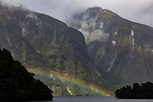 A rainbow and misty weather in Doubtful Sound, Southland in New Zealand A rainbow and misty weather in Doubtful Sound, Southland in New Zealand