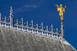 The roof and golden statue on the Ypres Cloth Hall in Belgium The roof and golden statue on the Ypres Cloth Hall in Belgium