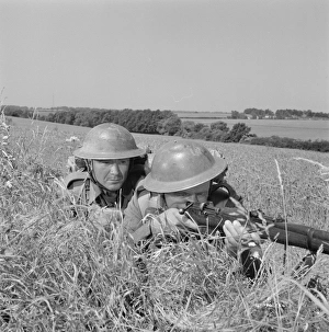 Corporal Bins and a comrade take aim in the countryside Corporal Bins and a comrade take aim in the countryside