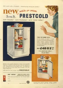 A compact, white Prestcold refrigerator sits on a table
