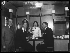 Barmaids serve coffee to businessmen in an Automatic Restaurant