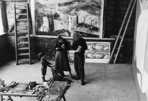 John Piper in his studio with family, 1964
