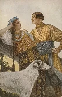 Russian couple in medieval costume, with large dog