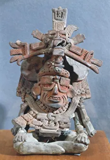 Anthropomorphic clay funerary urn depicting the Old God, Monte Alban style, Mexico, Zapotec civilization Anthropomorphic clay funerary urn depicting the Old God, Monte Alban style, Mexico, Zapotec civilization
