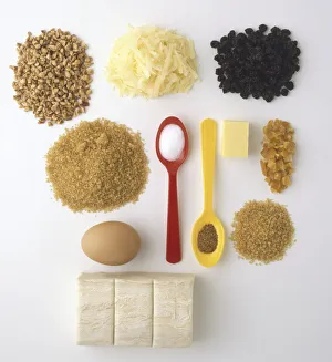 Assorted baking ingredients; chopped roasted hazelnuts, grated cheddar cheese, currants Assorted baking ingredients; chopped roasted hazelnuts, grated cheddar cheese, currants