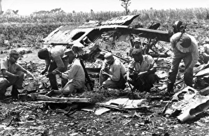 Bay of pigs, 1961, cuban militia examining the wreckage of plane shot down by artillery Bay of pigs, 1961, cuban militia examining the wreckage of plane shot down by artillery